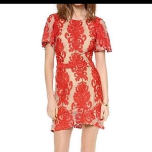 For love and lemons red and beige damask style print.